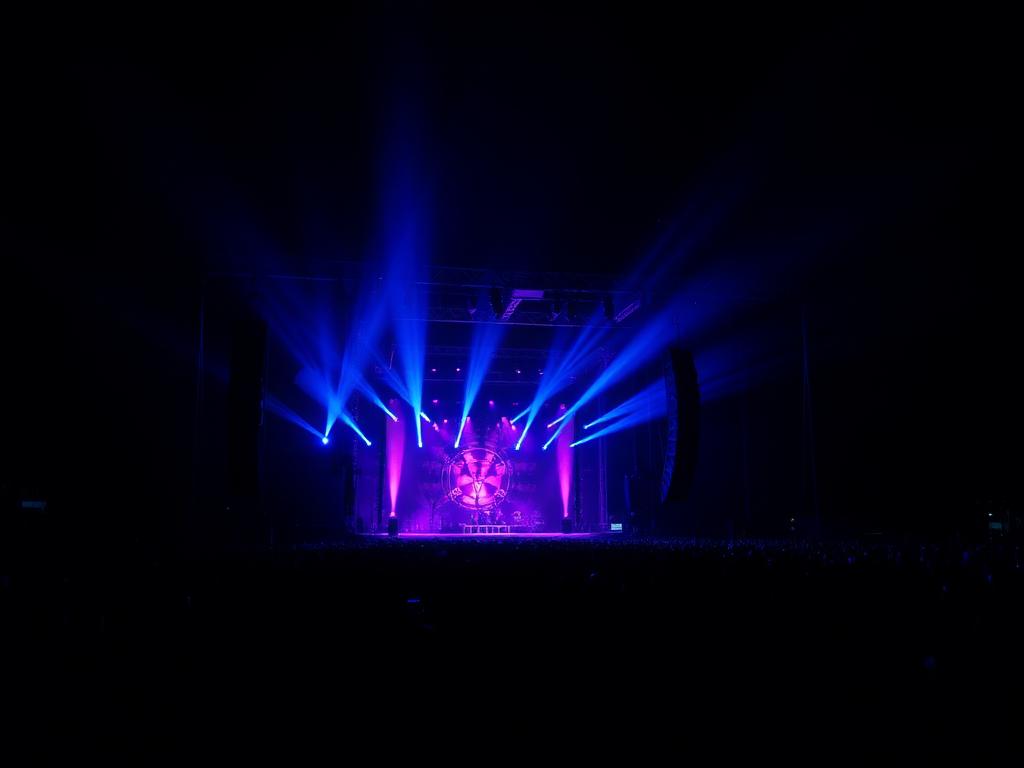 Live event with stage lighting and professional speakers